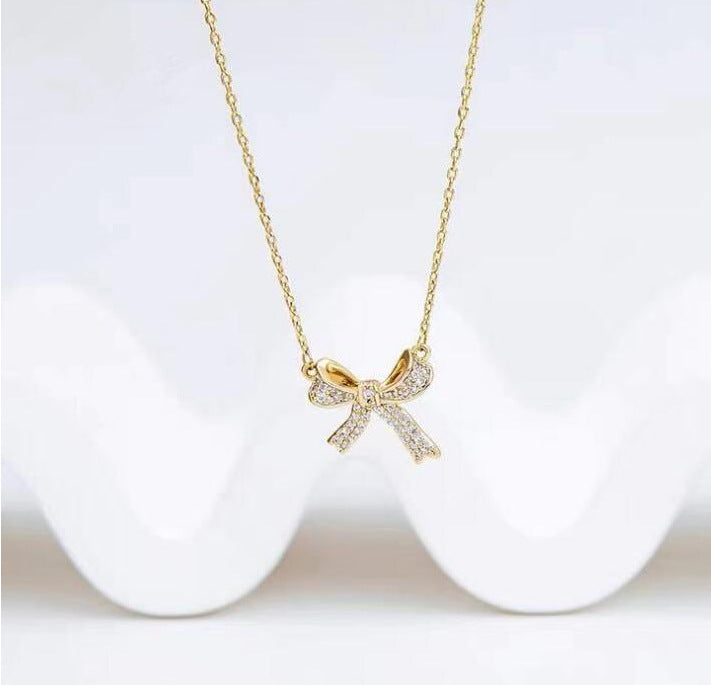 UNI-10233 - Bow Sparkle Gold - Necklace