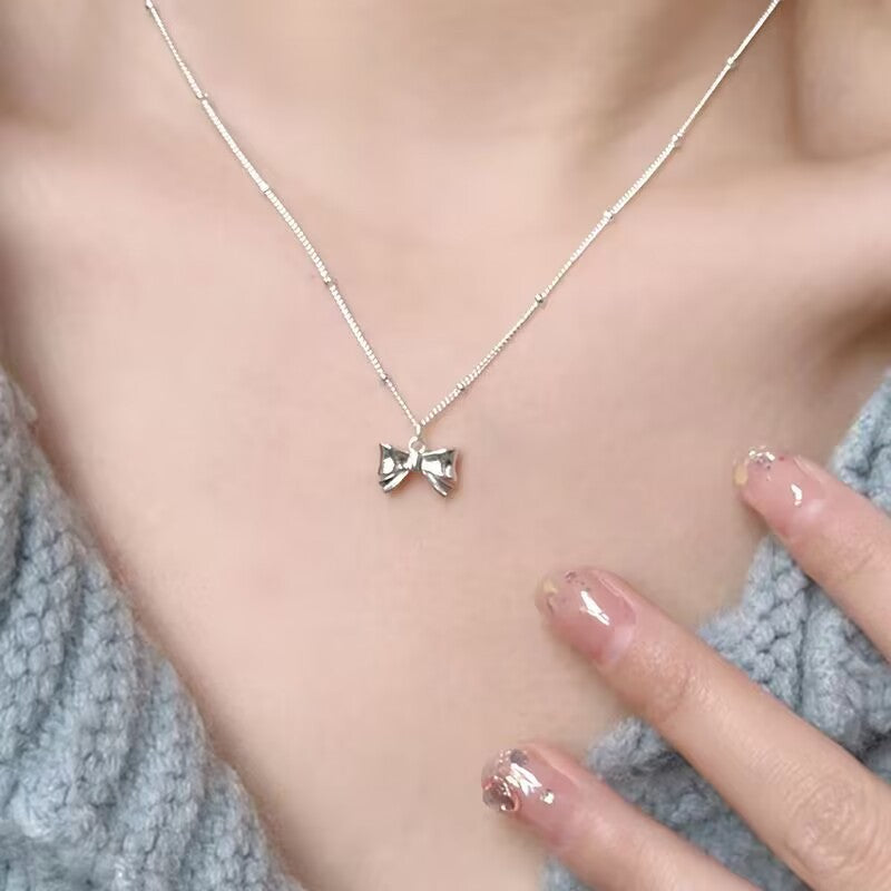 UNI-10274 - Bow Silver - Necklace